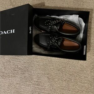 Coach Black Leather Boat Shoes with Woven Design